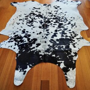 A Hide of Great Character - A Beautiful Bright White & Jet Black Coat Marked with a Single Red Centre Blaze -