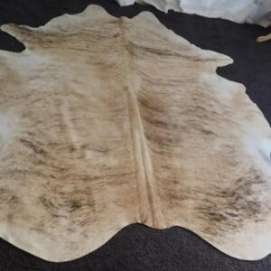 An Exceptional Cowhide Rug - A Gentle Wave over a Creamy Toned Base - Just Beautiful