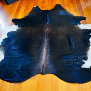 A Black & Tan Based Tri Coloured Hide - A Beautiful Cowhide Rug