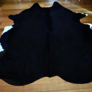 A Beautiful Shiny  Black  Cowhide Rug - Touched by White - A Classic Piece of Country Style