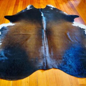 A Big & Beautiful Richly Coloured Black and Tan Based Tri Coloured Cowhide Rug