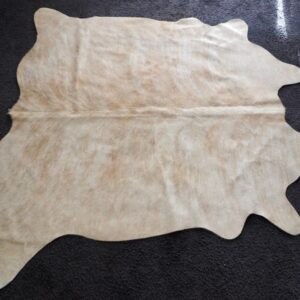 A Lovely Soft Ginger Red Wave washes over a pale Sandstone base - A Beautiful Smaller Sized Cowhide Rug