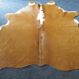 A Beautiful neat and ever so smart Traditional Brown and White  Hand Selected Cowhide Rug