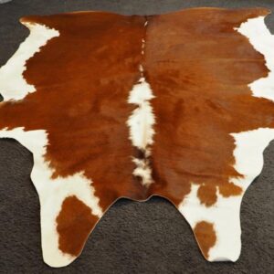 A Wonderful Richly Coloured Traditional Hereford Cowhide Rug