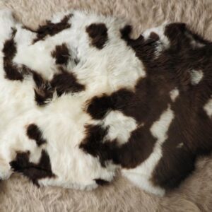 A Naturally Coloured Rich Dark Brown and White Sheepskin Rug