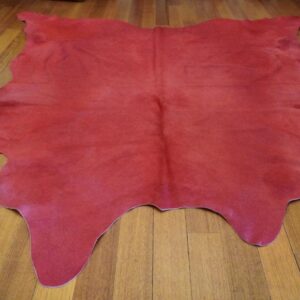 A Stunning Pillar Box Red Cowhide Rug
