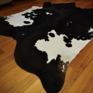 Dramatic Nearly Perfectly Symmetrical Markings Mark this Big and Totally Beautiful Cowhide Rug