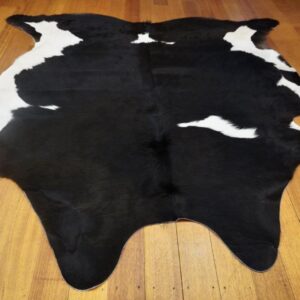 Thick and Soft - a gorgeous Jet Black Winter Coat -Framed in White - A Beautiful Cowhide Rug