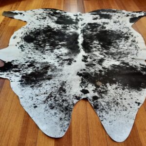A Beautiful Butterfly Design by the Artist in Nature - A Premium Hand Selected Cowhide Rug