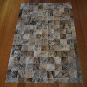 A Gorgeous Artisan Made Patchwork Cowhide Rug