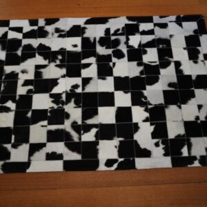 A Lovely Artisan Made Black and White Patchwork Cowhide Rug