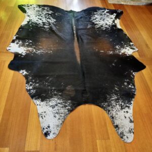 A Speckled Tri Coloured Cowhide Rug