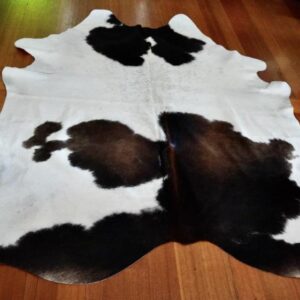 A Beautiful Smaller Sized Tri Coloured Cowhide Rug