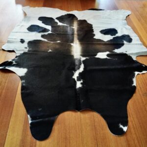 A Neat A D Branding & a Broad Arrow Blaze, A Feature FIlled Cowhide Rug