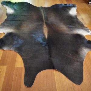 Dark Tones with a Distinctive Broad Arrow Centre Blaze  A Simply Beautiful Cowhide Rug -