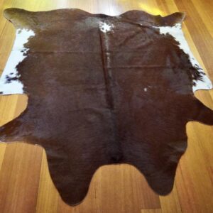A Lovely Smaller Sized Hereford Red & White Cowhide Rug