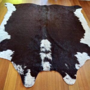 A Lovely Deep Red Mid Sized Hereford Cowhide Rug