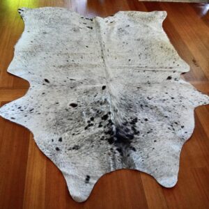 A Lovely Soft Mid Sized Tri Coloured Speckle Park Cowhide Rug