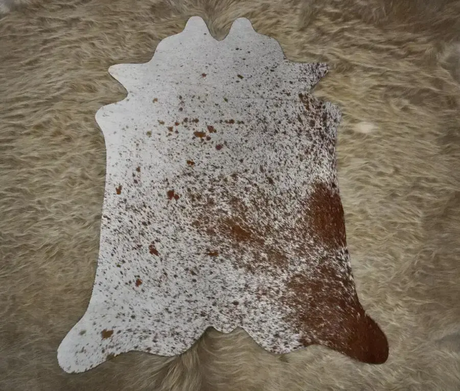 A LOVELY BROWN AND WHITE SPECKLE PARK. - MINI COWHIDE RUG