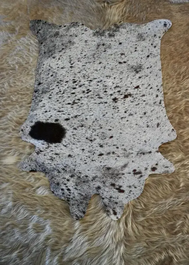 A Lovely Tri Coloured Speckle Park Mini Cowhide Rug