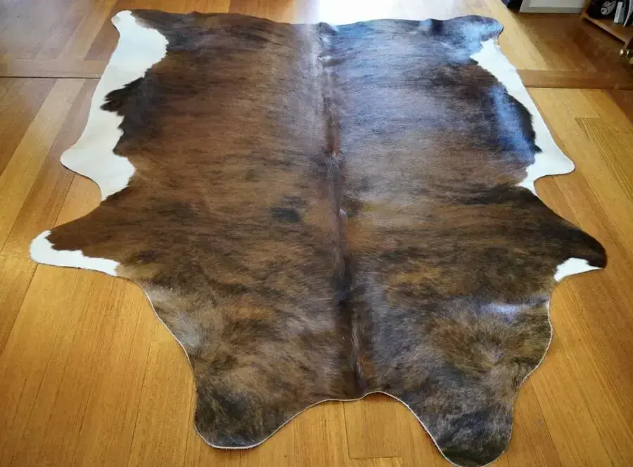 A Lovely Mid Sized Brindled Tri Coloured Cowhide Rug