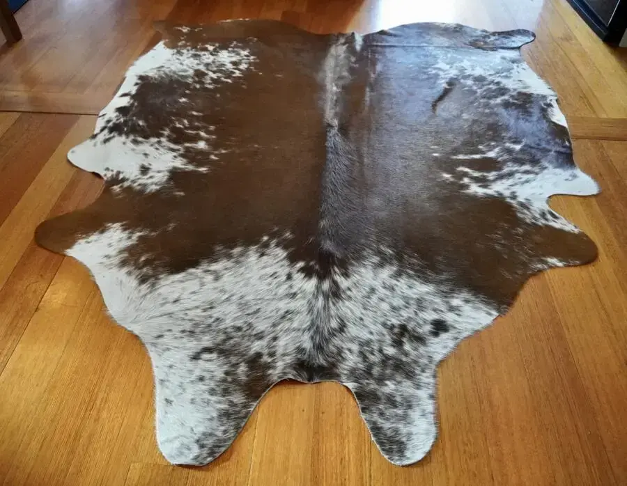 A Lovely White Speckling Frames this Rich Chestnut Brown Premium Cowhide Rug