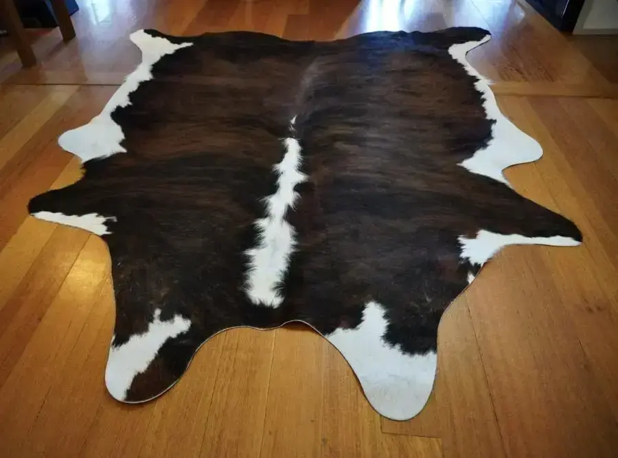 A White Framed Brindled Exotic Tri Coloured Cowhide Rug