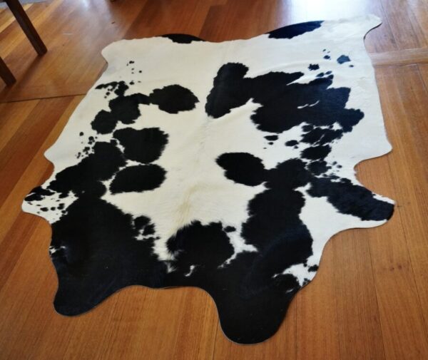 SYMMETRICAL MARKINGS - A STRIKING FRIESIAN COWHIDE RUG